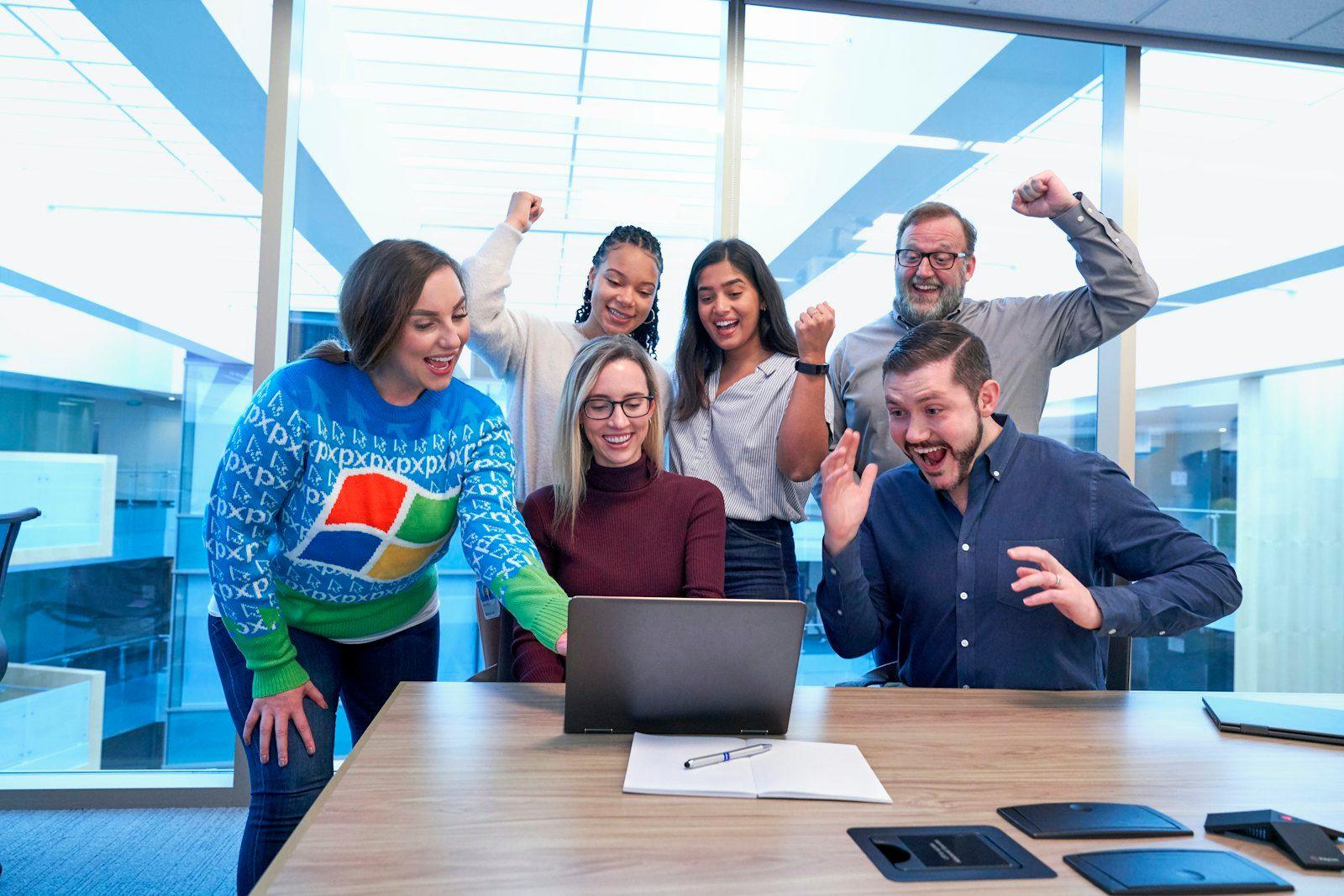 Team celebrating results in a modern office